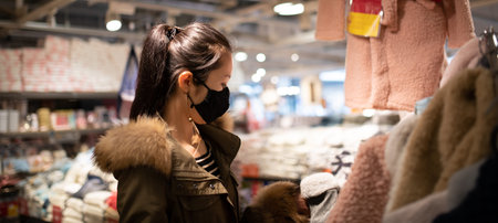 Woman shopping wearing a mask