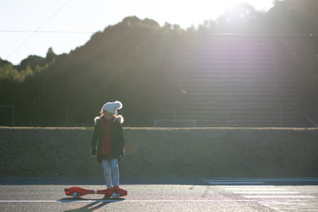 A child practicing a caster board