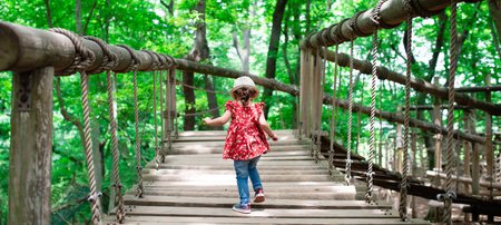 Girl playing in the forest parkの写真素材
