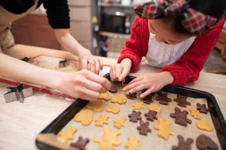 Mother and daughter making cookies