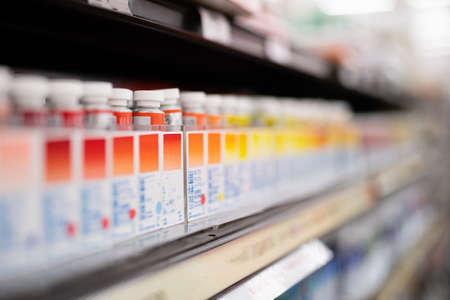 Paints lined up on the shelvesの写真素材