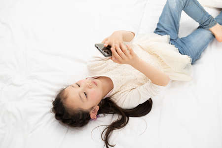 Girl using the smart phoneの写真素材