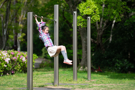 Girl playing on the horizontal bar