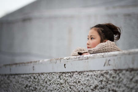 The girl looks far awayの写真素材