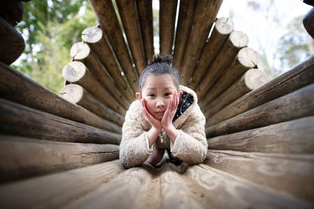 Girl playing in winter athleticsの写真素材