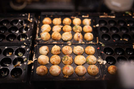 Lots of takoyaki during cookingの写真素材