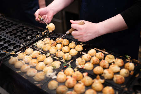 Lots of takoyaki during cookingの写真素材