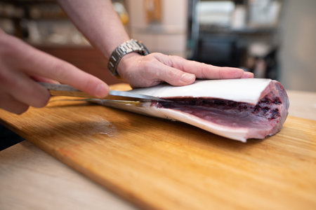 Hands of a man who handles fish