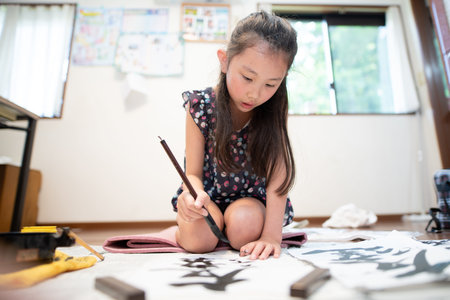 child practicing calligraphy