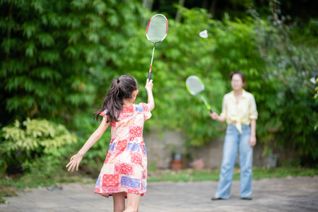mother and daughter playing badmintonの写真素材