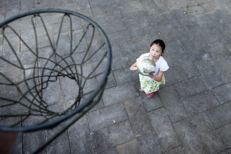 girl playing basketball in the parkの写真素材