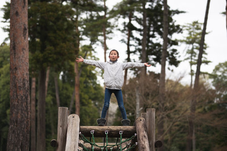 Girl playing in spring parkの写真素材