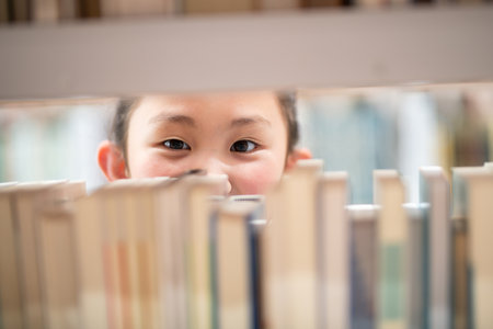 child looking for a bookの写真素材