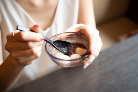 woman eating shiratamaの写真素材