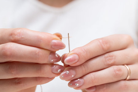Manicure process. Close-up of female hands doing manicure