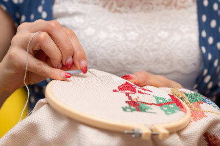Hands of a woman doing embroideryの写真素材