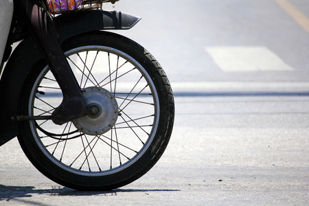 Old motorcycle front wheelの写真素材