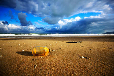 Old glass bottle on the beachの写真素材