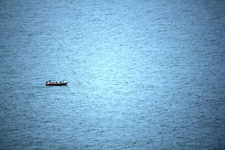 Small boat of fisherman floating in the sea.の写真素材