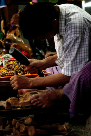 Myanmar is carving a wooden Buddha.の写真素材