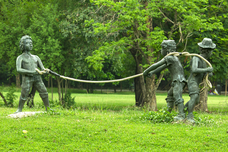 statue of a kid playing in a park.の写真素材