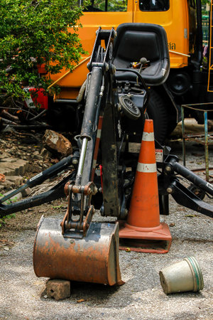 Old backhoe is parked, no maintenance.