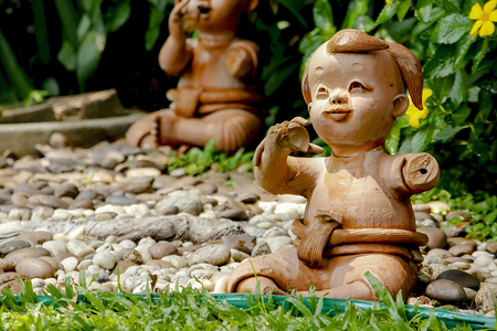 Clay dolls used for garden decoration.の写真素材