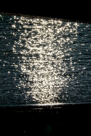 Sparks on the surface where sunlight hits.
