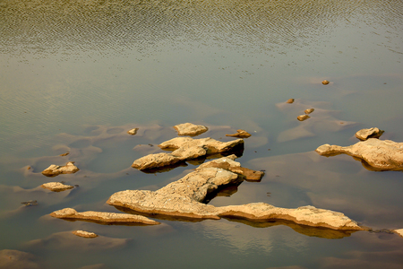 Rocks above the surface of the pond.の写真素材