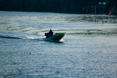 Fishermen are sailing on the water.