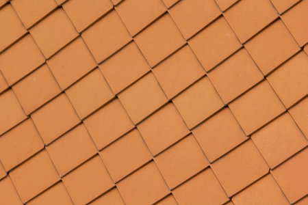 The roof is made of stacked clay tiles.
