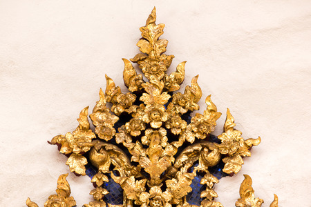 A pattern that is unique to Thailand on a temple wall.の写真素材