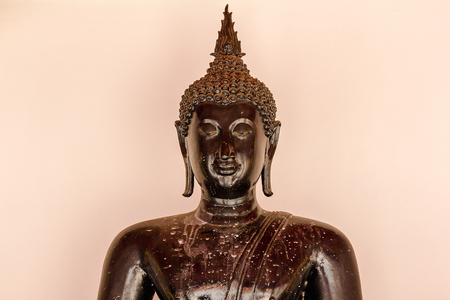 Black Buddha that is unique in carvingの写真素材