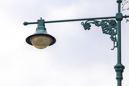 Lamp mounted on a green poleの写真素材