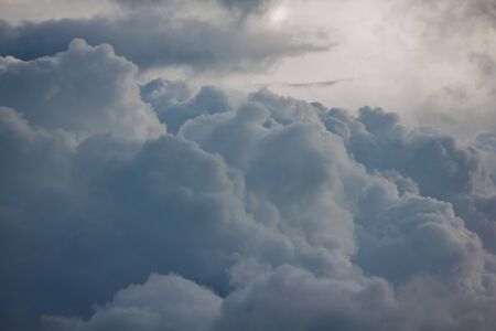 Clouds of rain on the sky began to form before falling.の写真素材
