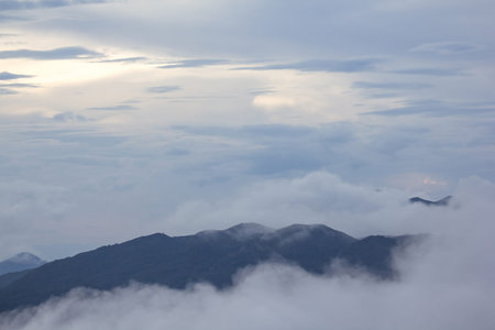 The fog moved over the mountains after the rain.