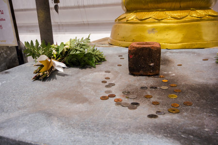 In Thai temples, coins were placed on the floor.の写真素材