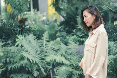Women wearing brown shirts posing in the garden