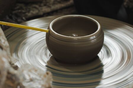 Making pottery by hand to make a containerの写真素材