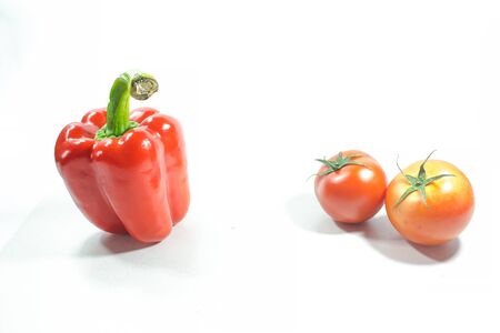 Red bell pepper, Red tomatoes on the White Background Used in cooking and eating freshの写真素材