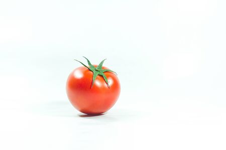 Red tomatoes on the White Background Tomatoes are eaten when ripe, red Or fully ripe orangeの写真素材
