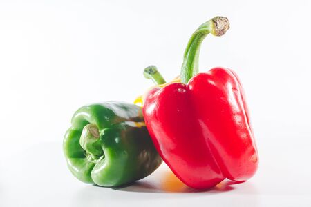 Sweet peppers are on a white background, sweet peppers are used for cooking and to be eaten fresh, sweet peppers are non-spicy peppers.の写真素材