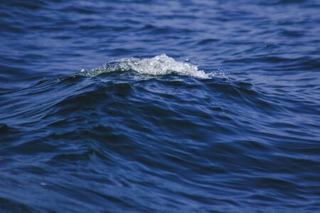 Sea water splashes, splashes of waves, views of the sea,close up the sea water surfaceの写真素材