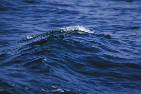 Sea water splashes, splashes of waves, views of the sea,close up the sea water surfaceの写真素材