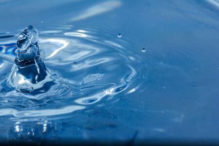 Water droplets, Blue water drops splashes. Drop water close-up, Blue water drop macroの写真素材