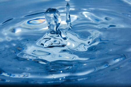 Water droplets, Blue water drops splashes. Drop water close-up, Blue water drop macroの写真素材