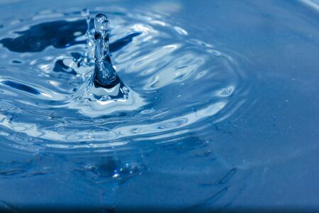 Water droplets, Blue water drops splashes. Drop water close-up, Blue water drop macroの写真素材
