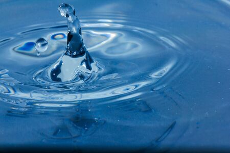 Water droplets, Blue water drops splashes. Drop water close-up, Blue water drop macroの写真素材