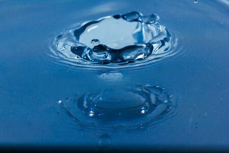 Water droplets, Blue water drops splashes. Drop water close-up, Blue water drop macroの写真素材