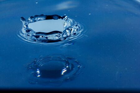 Water droplets, Blue water drops splashes. Drop water close-up, Blue water drop macroの写真素材